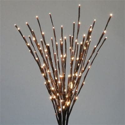 A bundle of lit twig branches with warm white LED tips.