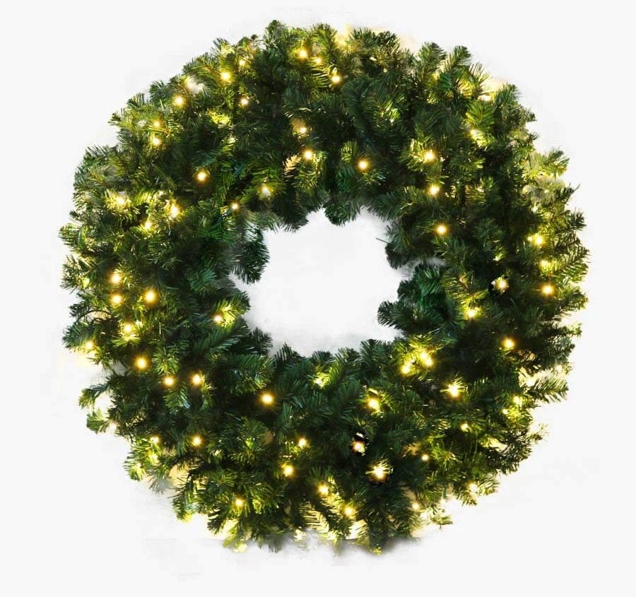 A full evergreen wreath lit in warm white minis.