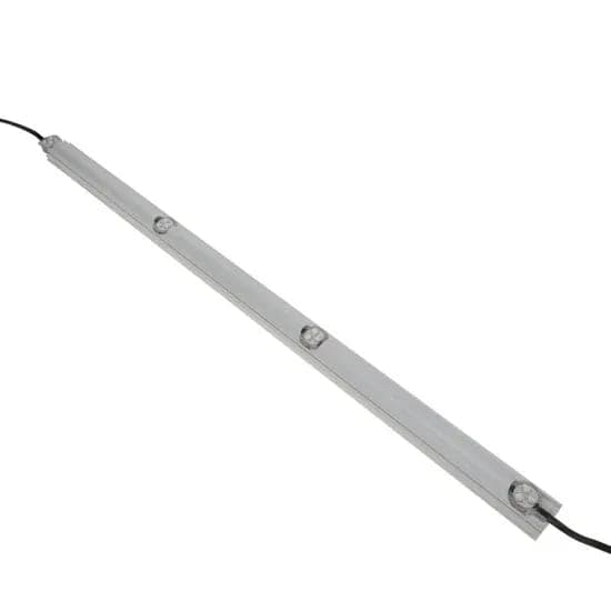 A run of puck lights seated in a slim white track with the lead wire out one end.