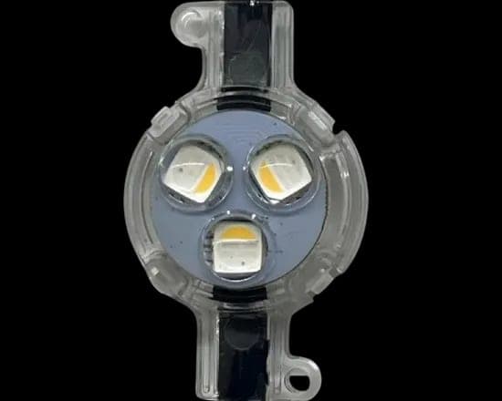 A round three-diode puck light module with a clear lens and moulded mounting tabs.