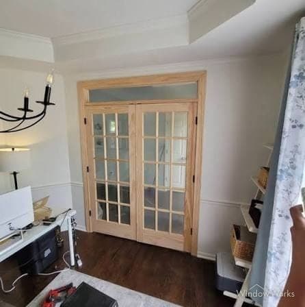 Interior French doors with divided glass panes and a frosted transom in an Eastside Seattle home