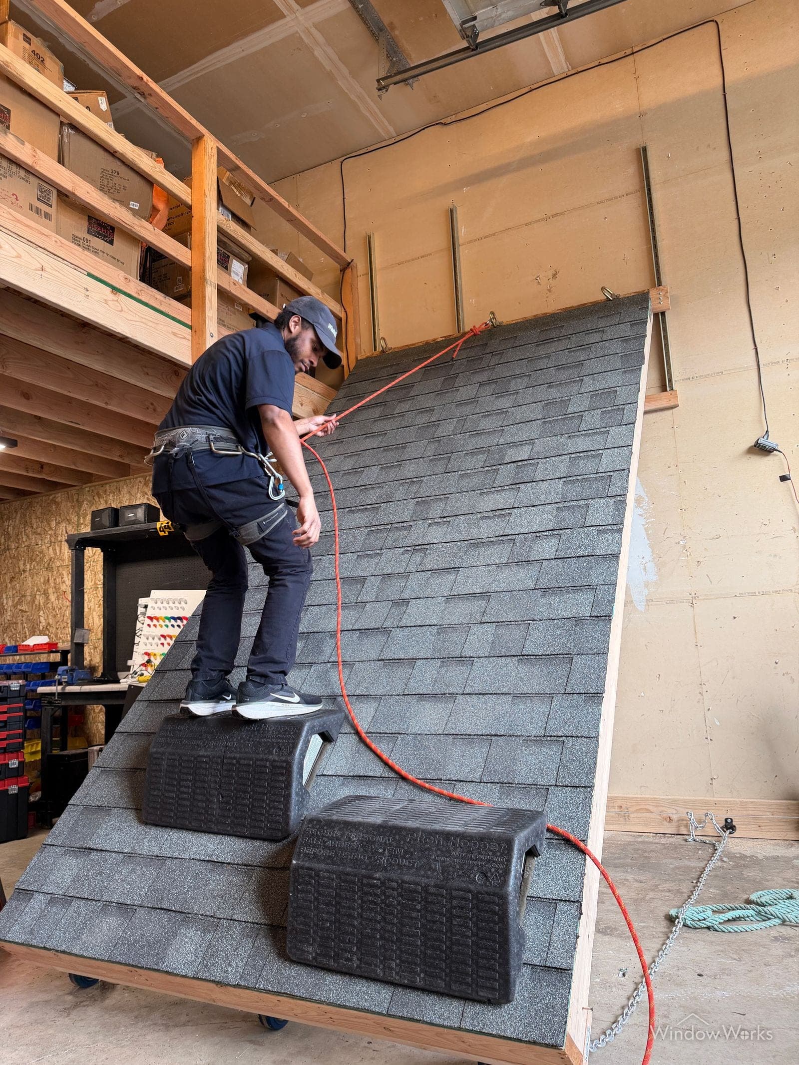A WindowWorks technician training on the mock roof at our facility